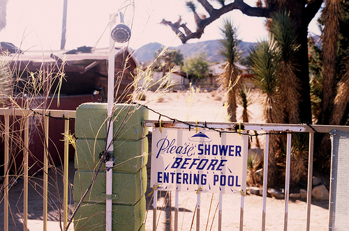 "Please shower before entering pool" sign